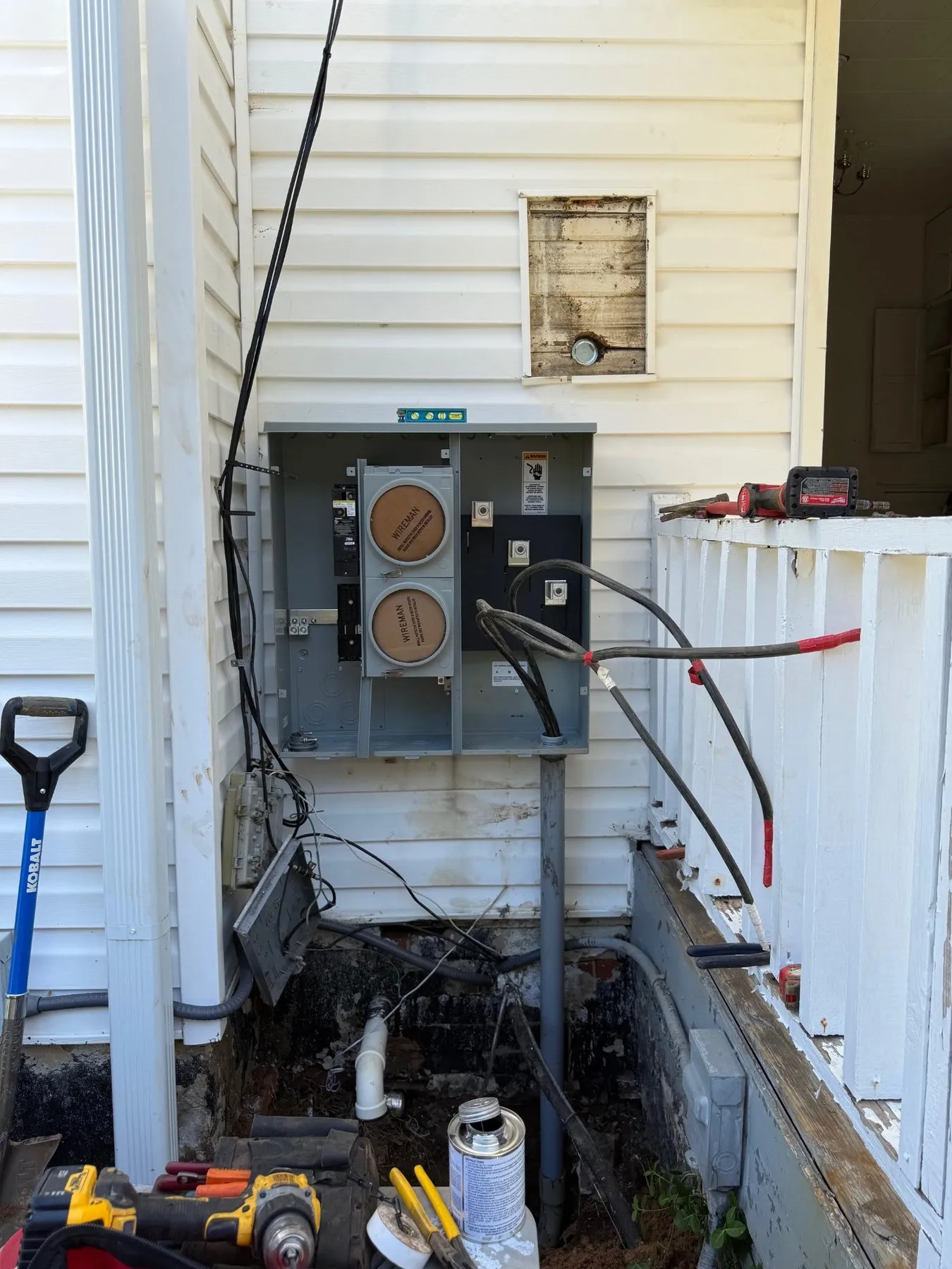 New two-meter service for a duplex mounted on vinyl siding